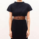 Brown leather handbag with buckle detailing.